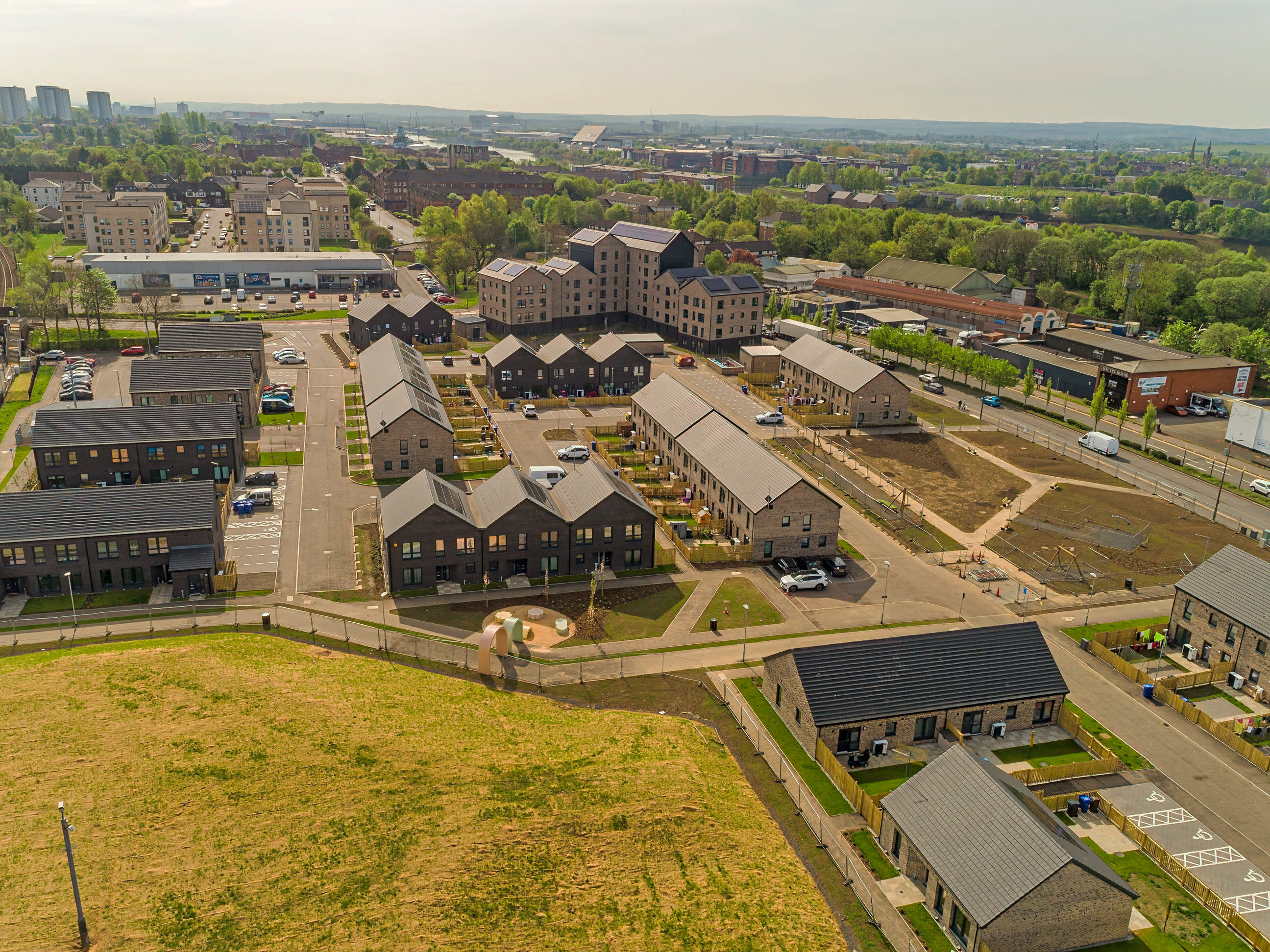 Aerial view of the new Clydebank East 88-unit housing development, showing the site's urban regeneration and high-quality homes.