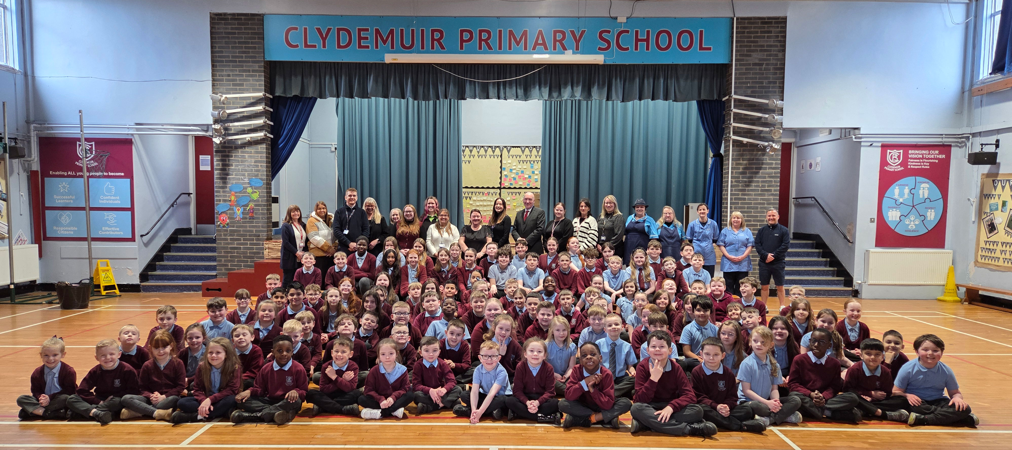 Staff and pupils at Clydemuir Primary School along with community partners and Vice Convener of Educational Services, Councillor John Millar