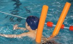 Boy having swimming lessons