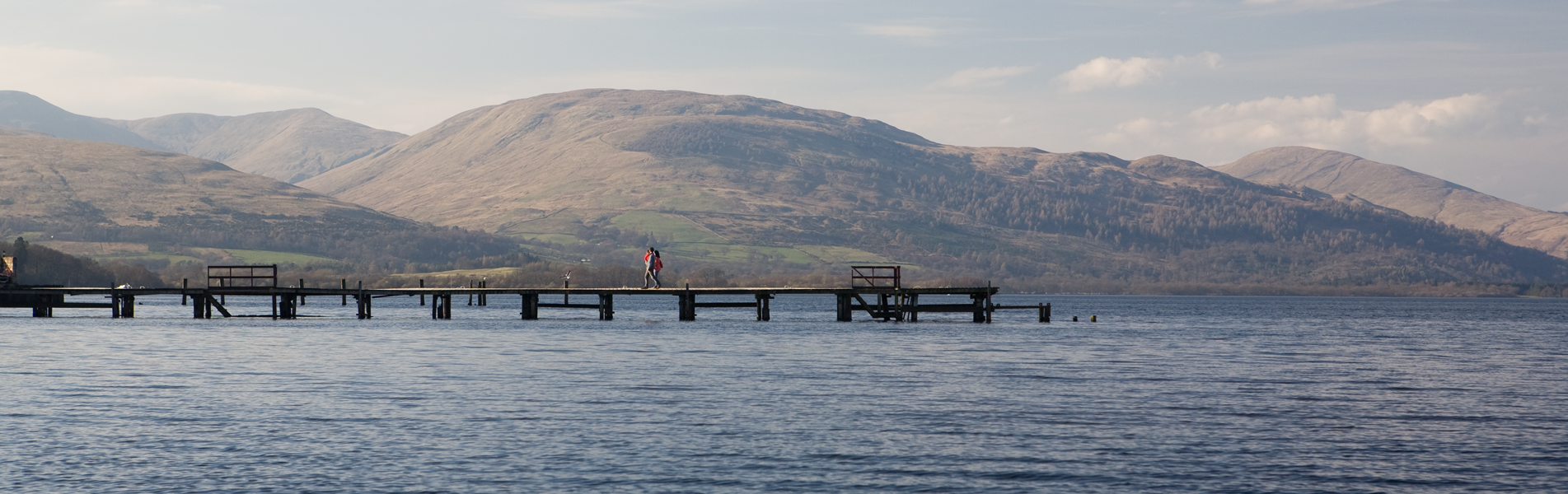 Pier on Loch Lomond with the hills in the background