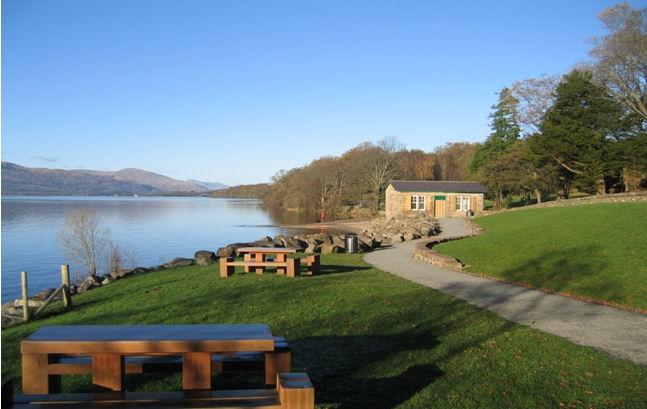 Boat House After - open, new path, bench area, weeds cleared and replaced by garden and grass