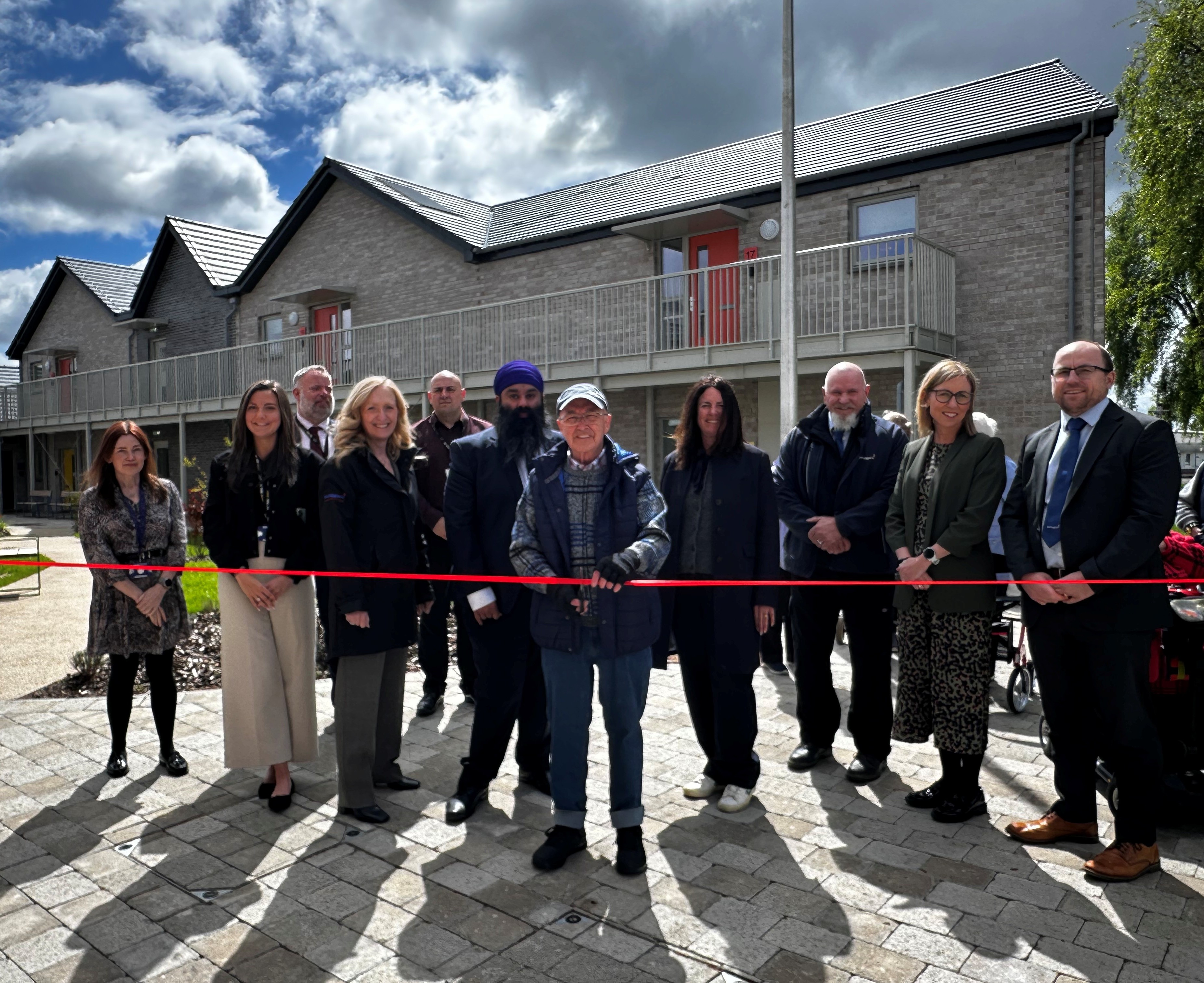 Residents and officials from West Dunbartonshire Council and McTaggart construction gather for the official opening of Willox Park