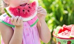 Girl eating watermelon for WD schools wellbeing project