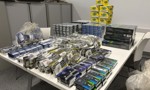A pile of various counterfeit cigarette and tobacco packets seized by Trading Standards officers