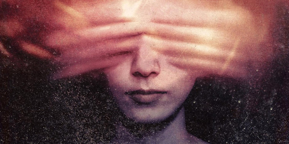 A darkly textured, atmospheric close-up portrait of a person whose eyes are obscured by a horizontal band of flowing, reddish-orange light and shadow.