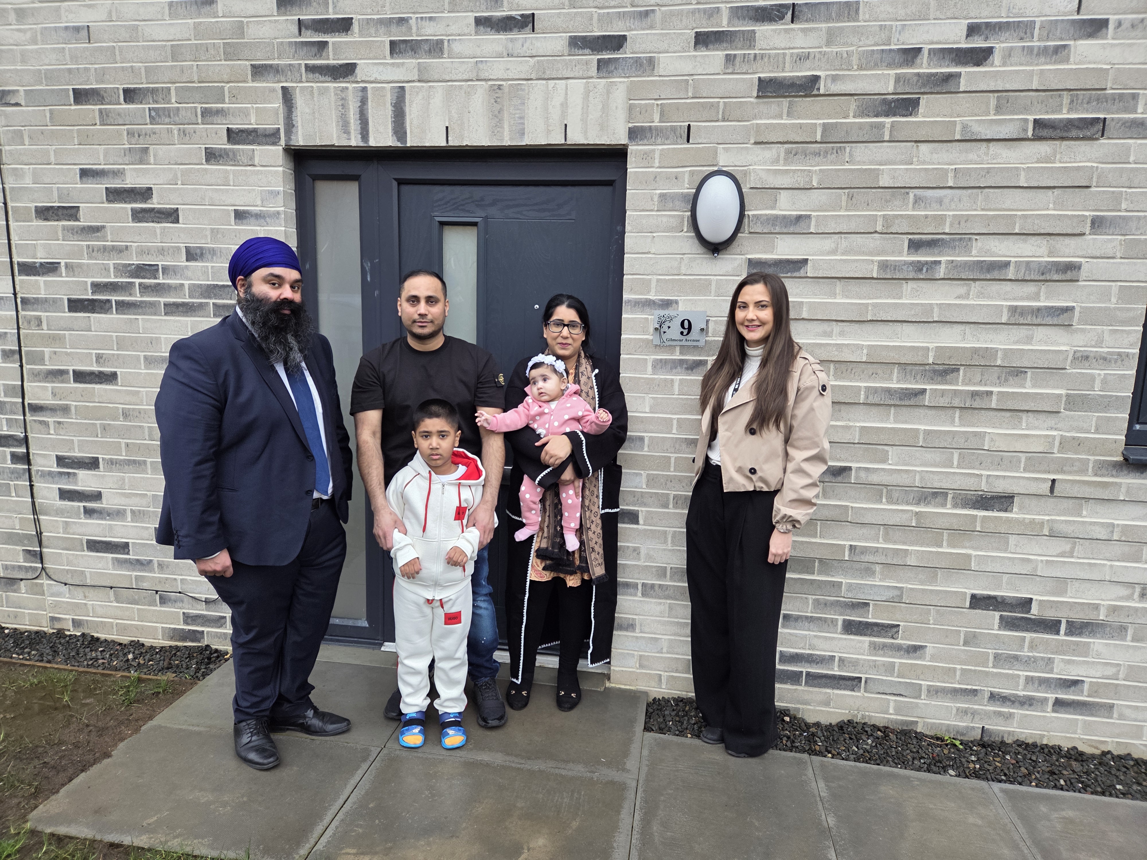 Sania Ishtiaq, her husband Amirmehmood, her son Huzaifamehmood and daughter Hadiyaamir with Convener of Housing, Councillor Gurpreet Singh Johal and Strategic Housing Officer Mikayla Deeley 