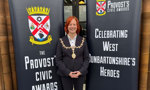 Provost Karen Murray Conaghan - beside signs for the Provost's Civic Awards